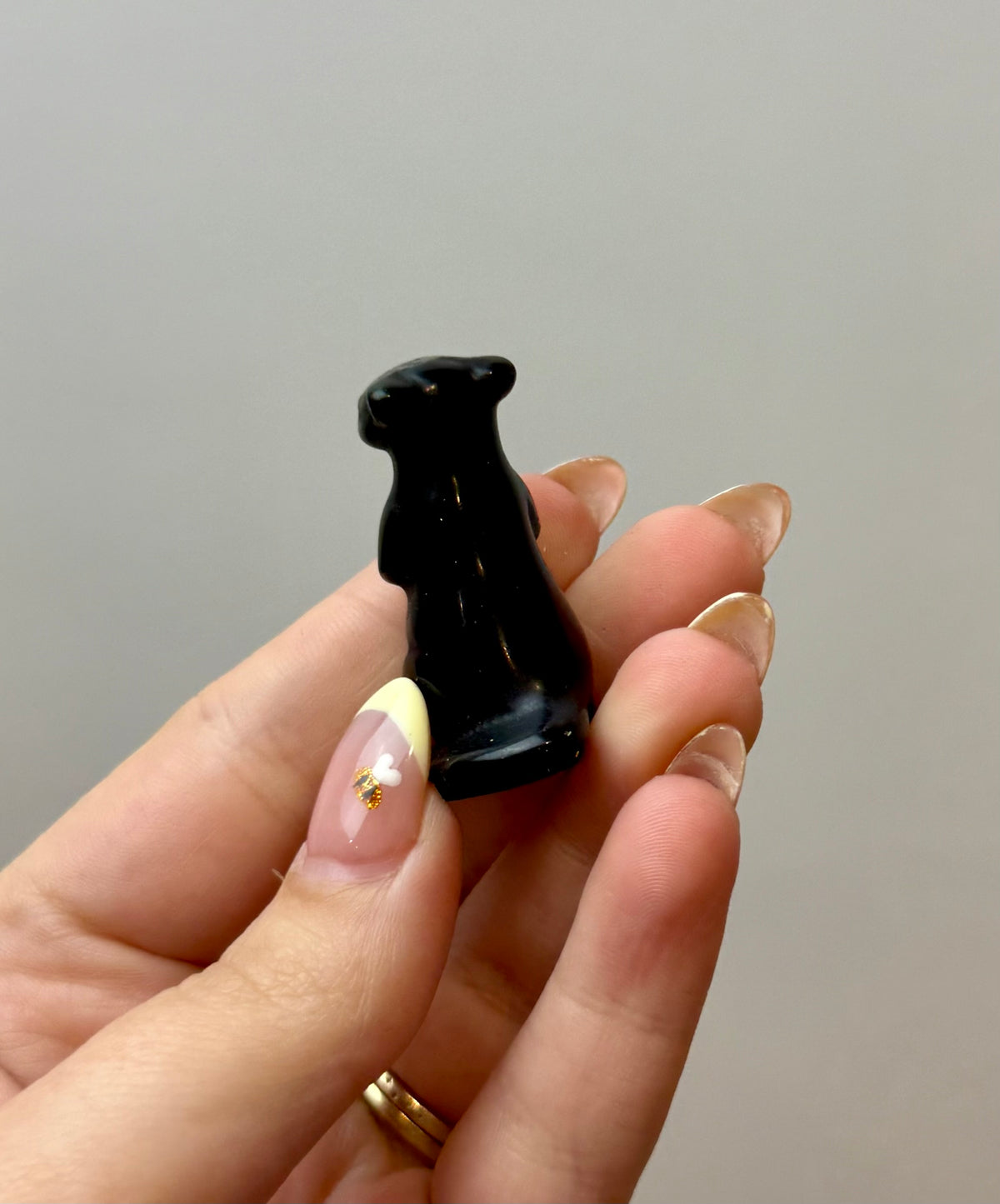 Obsidian meerkat carving