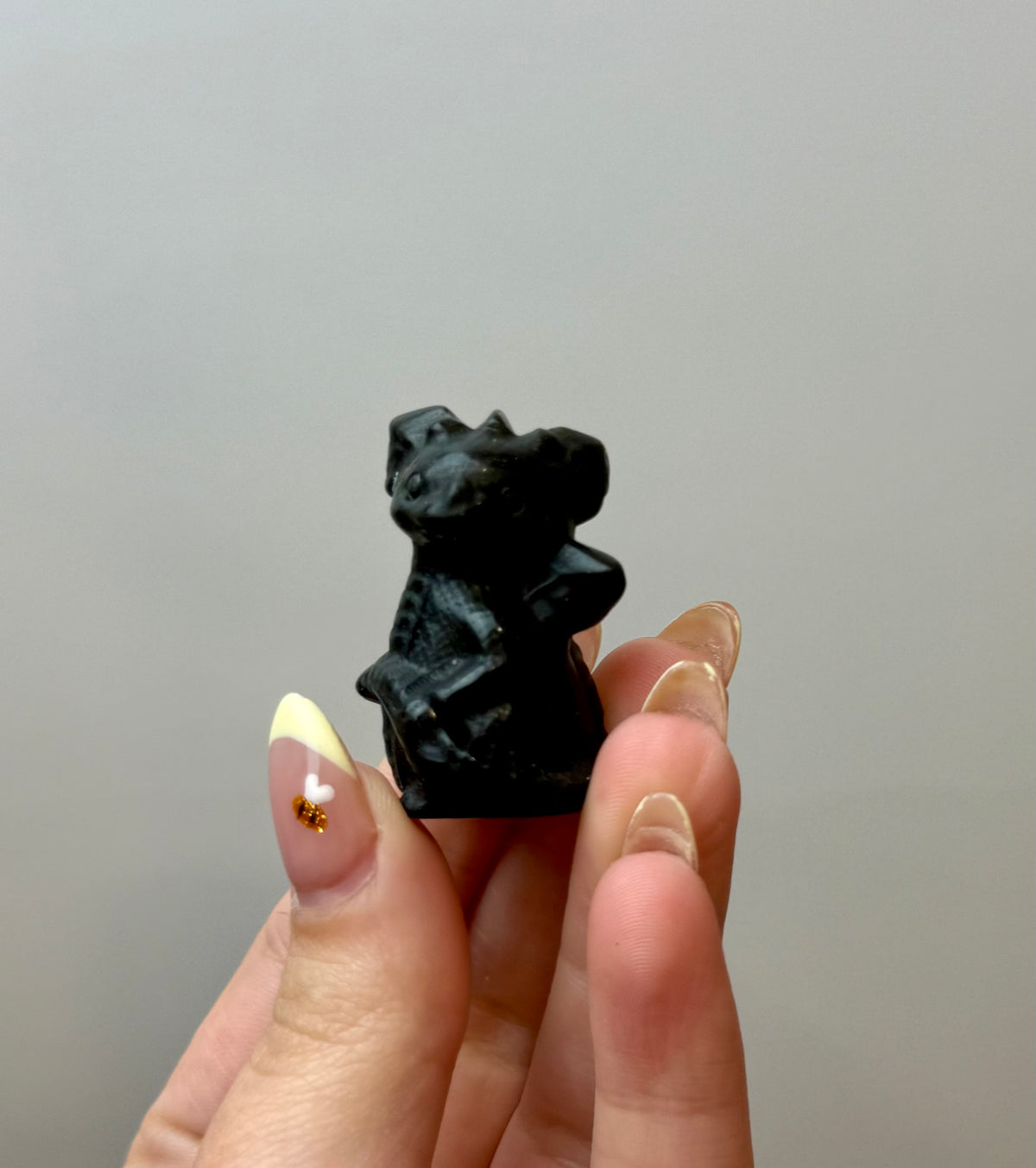 Obsidian dragon carving