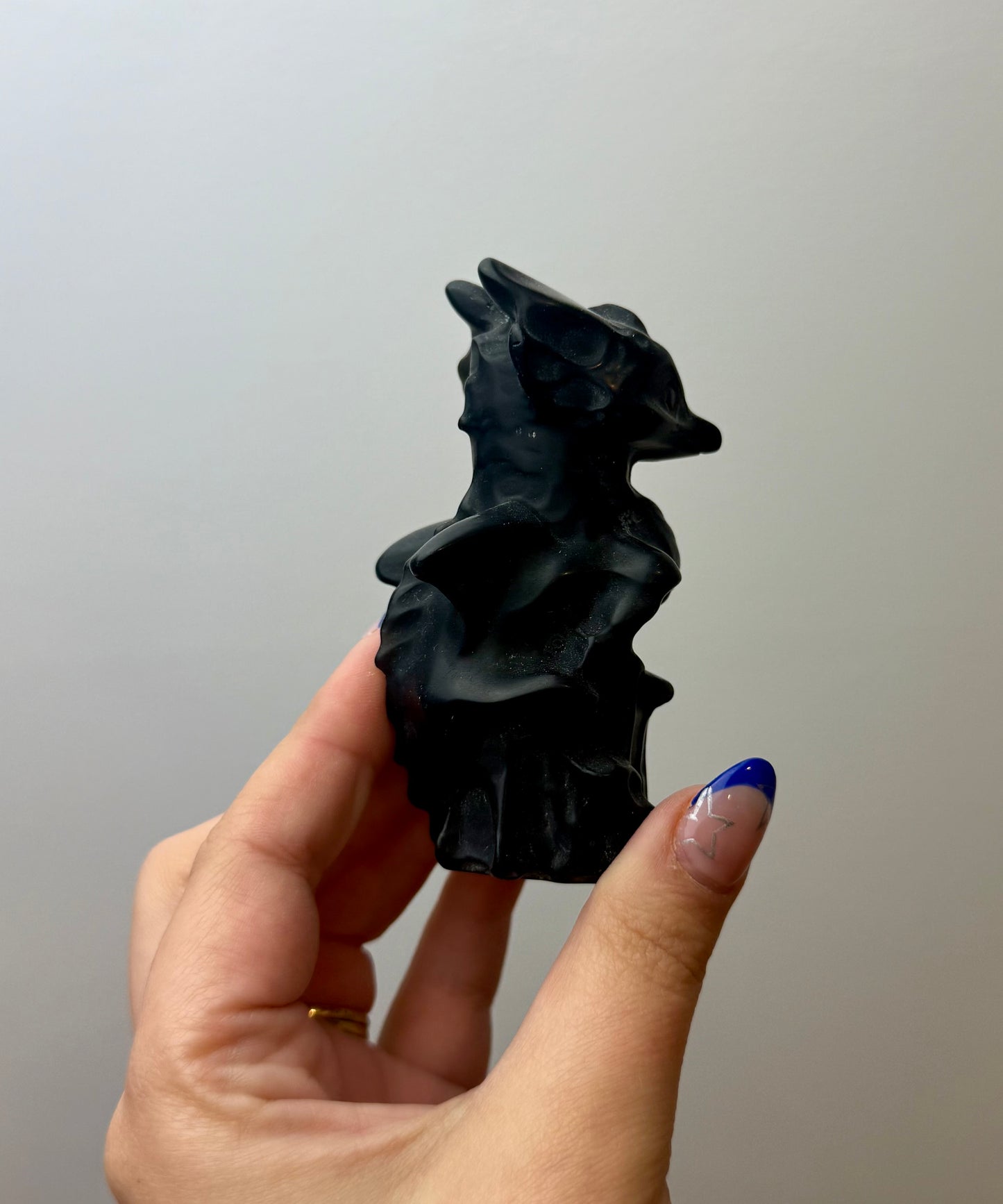 Obsidian dragon carving