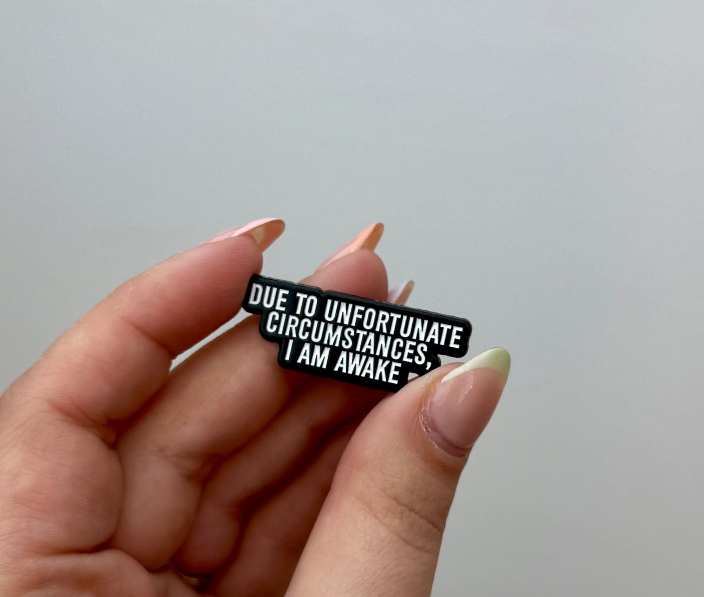 Unfortunate circumstances I am awake enamel pin