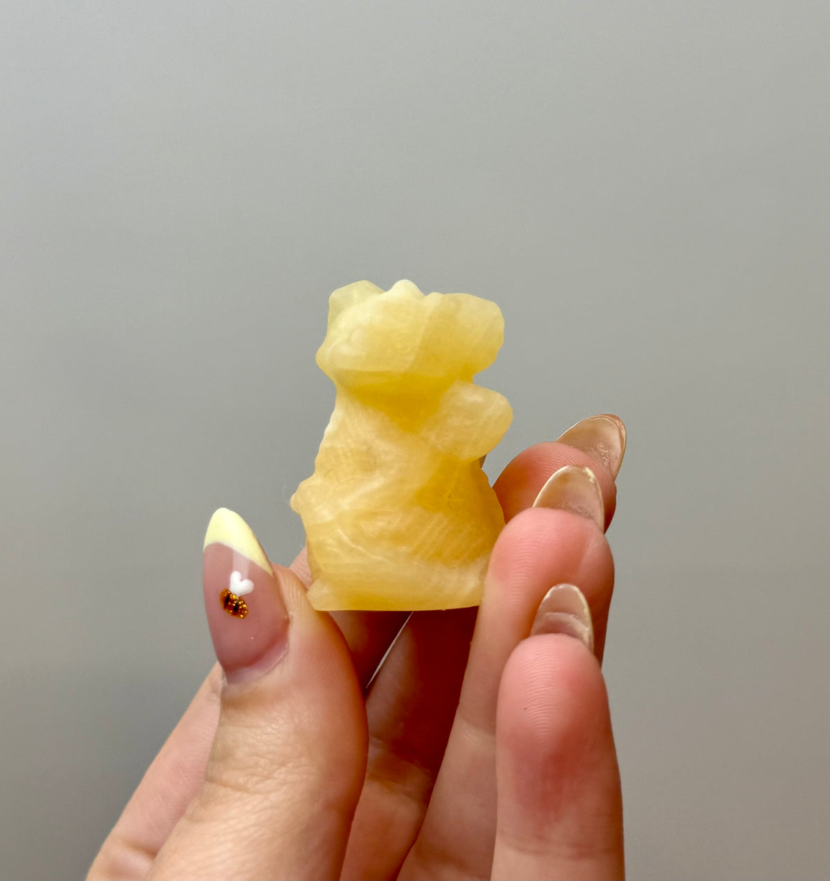 Orange calcite dragon carving