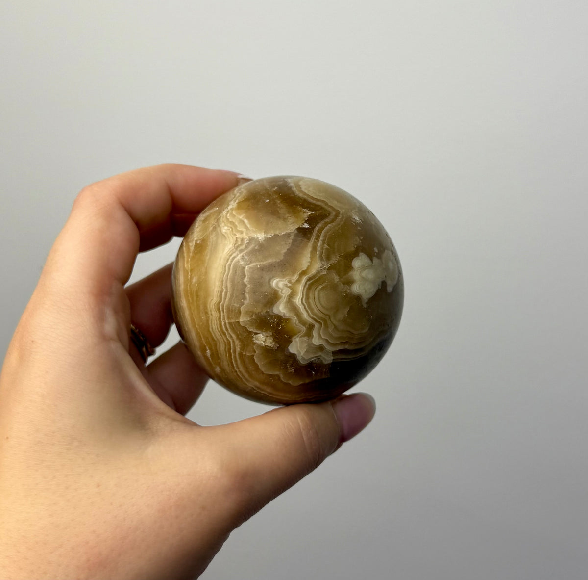 Amber calcite sphere