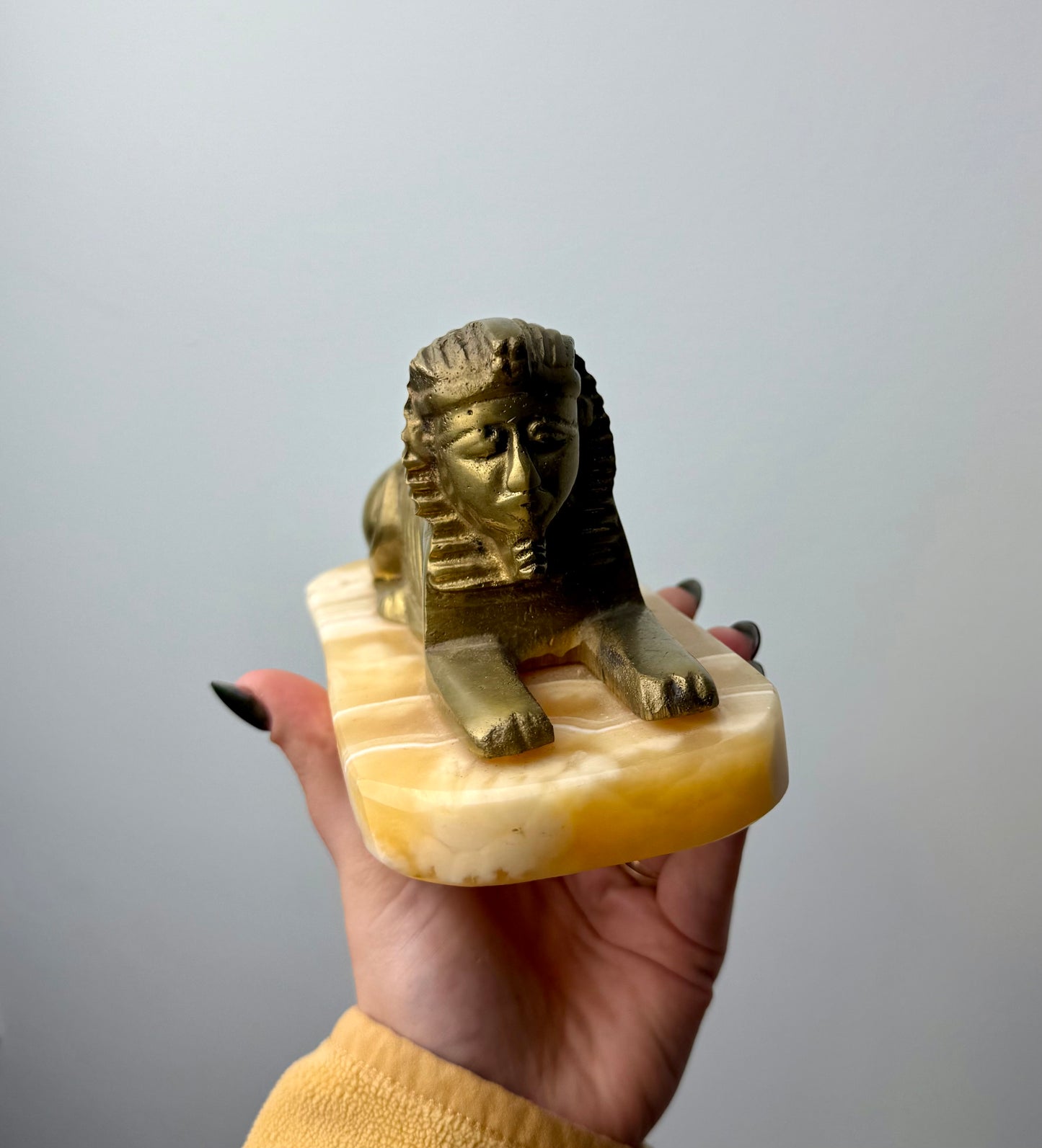 Orange calcite Spinx carving thrifted find ￼￼