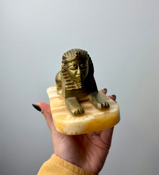 Orange calcite Spinx carving thrifted find ￼￼