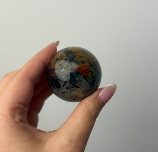 Black tourmaline in quartz sphere