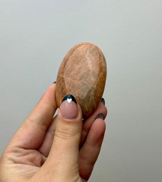 Peach moonstone palm stone