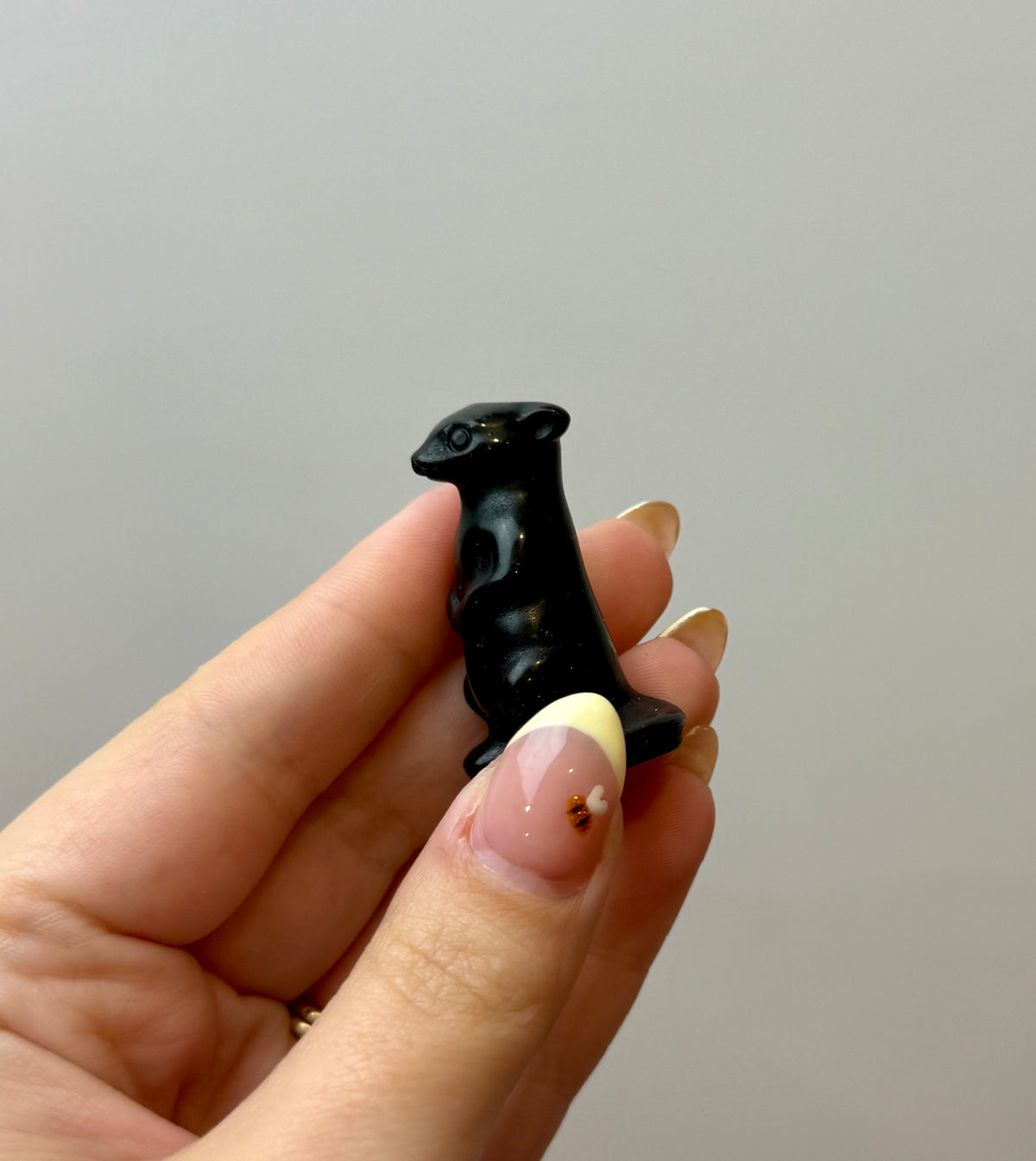 Obsidian meerkat carving