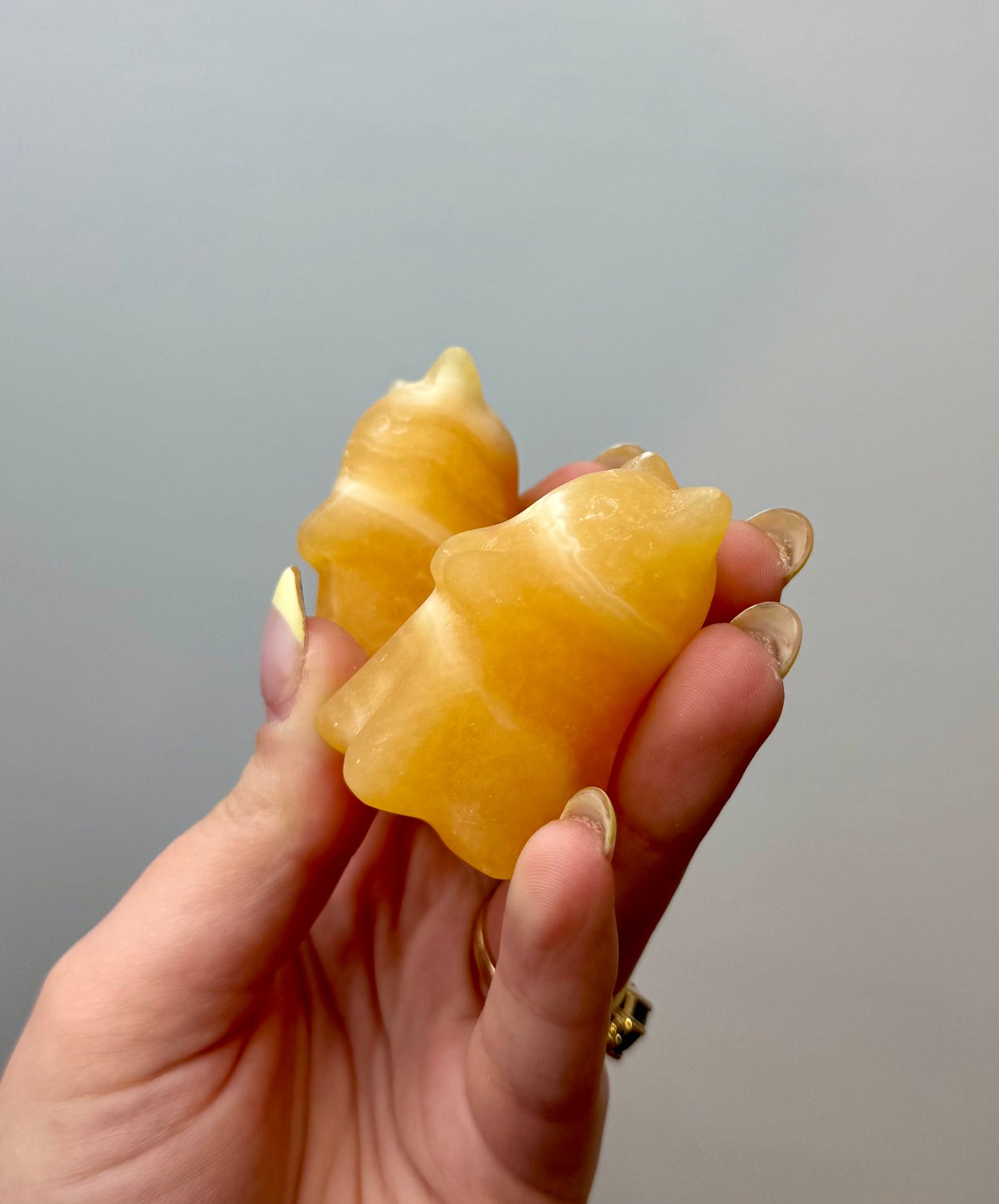 Orange calcite ghost cat carvings