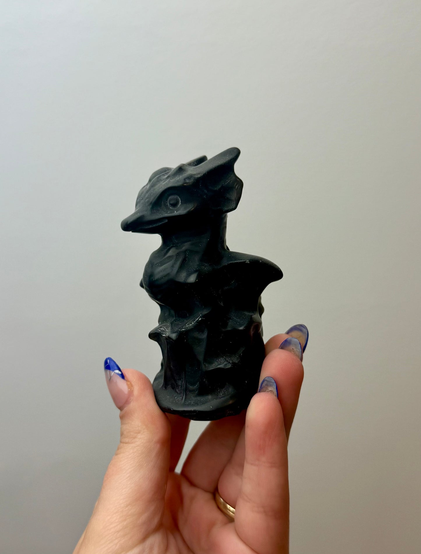 Obsidian dragon carving