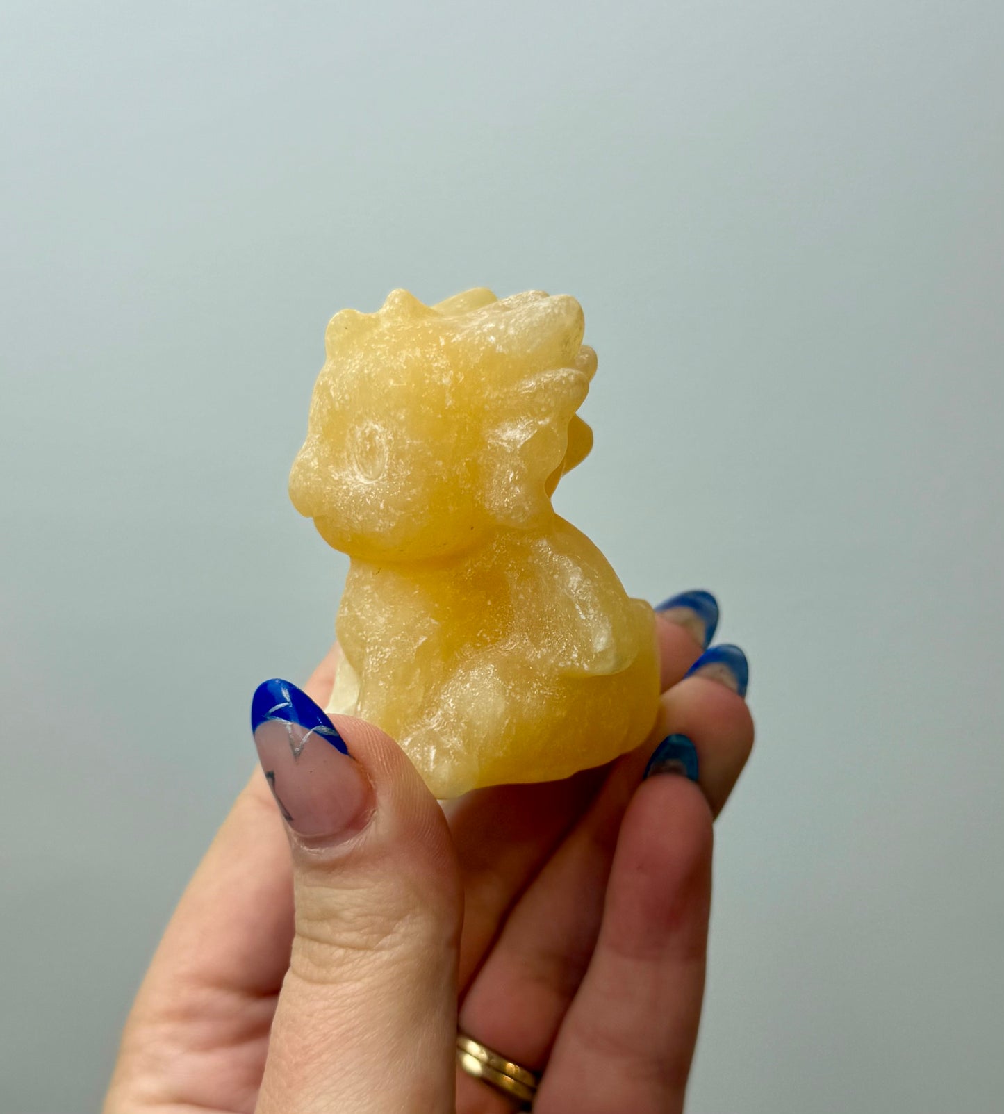 Orange calcite dragon carving