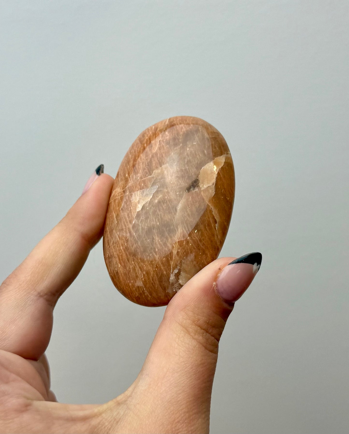 Peach moonstone palm stone