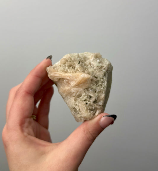 Peach stilbite specimen