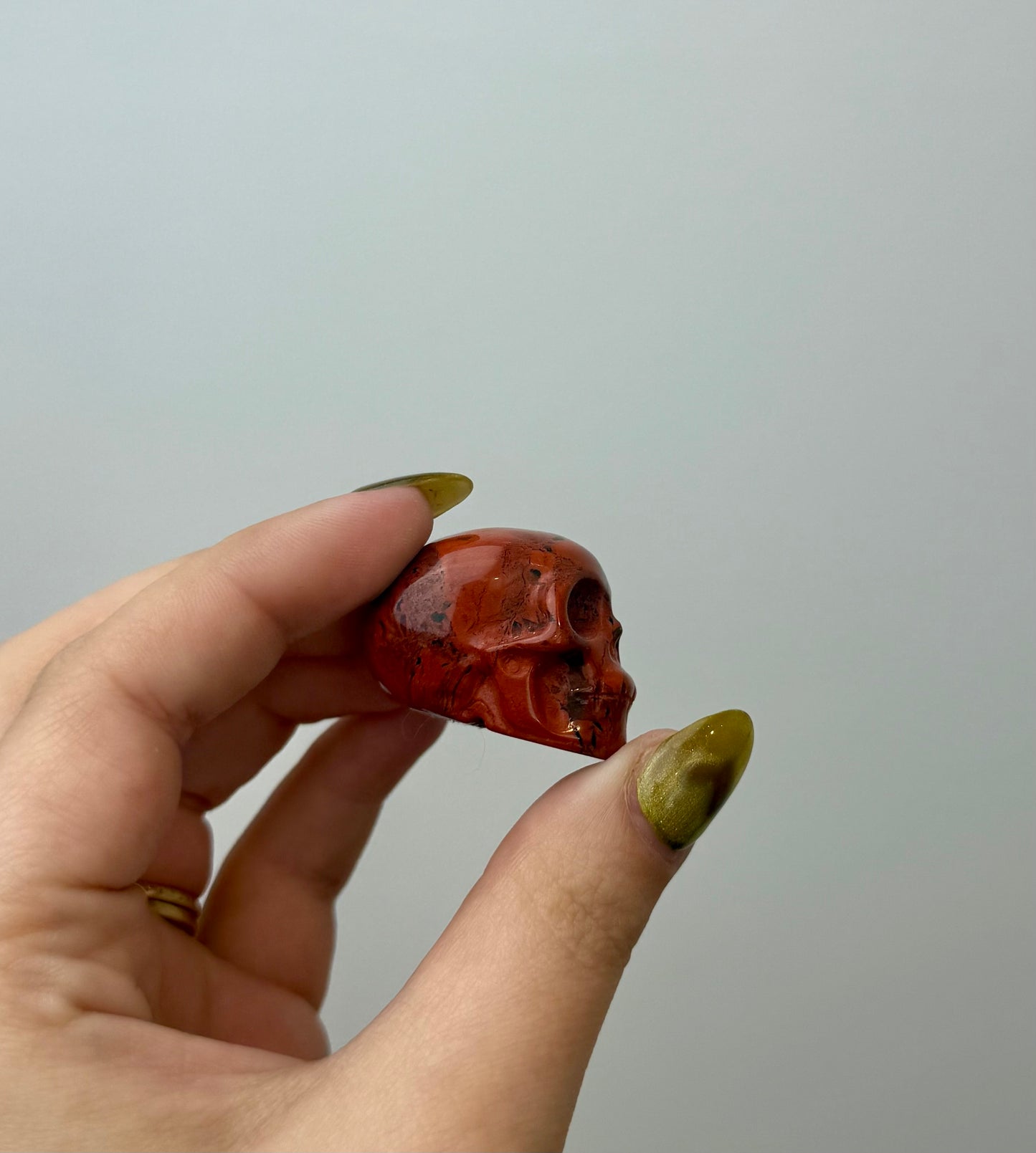 Red jasper skull carving