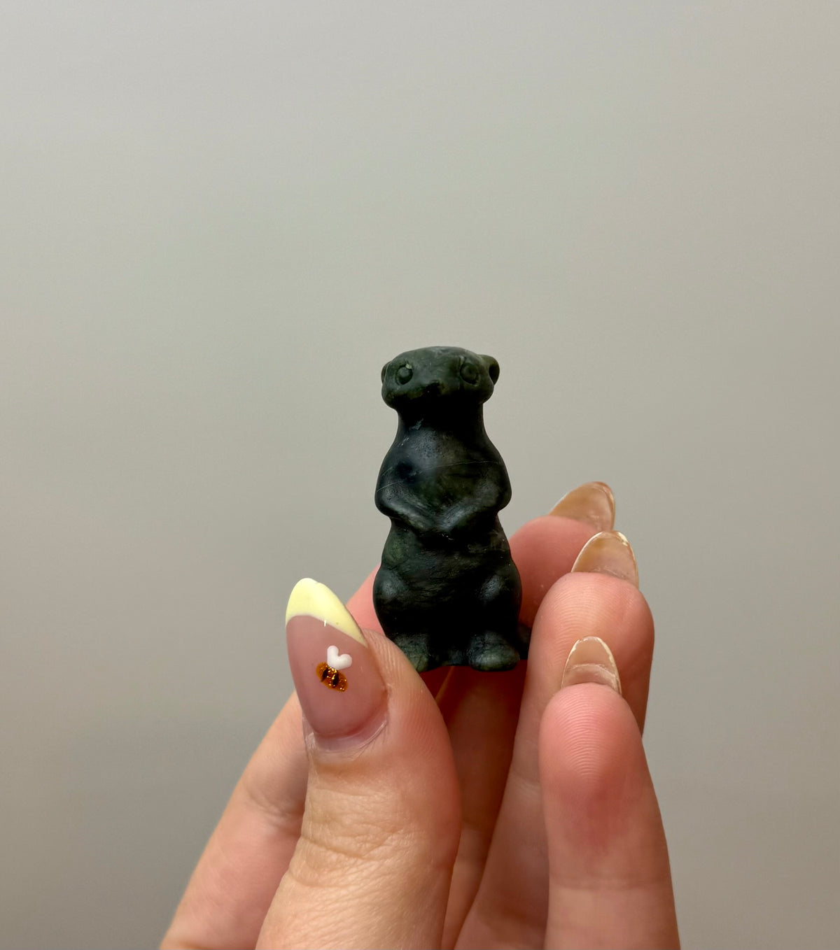 Jade meerkat carving