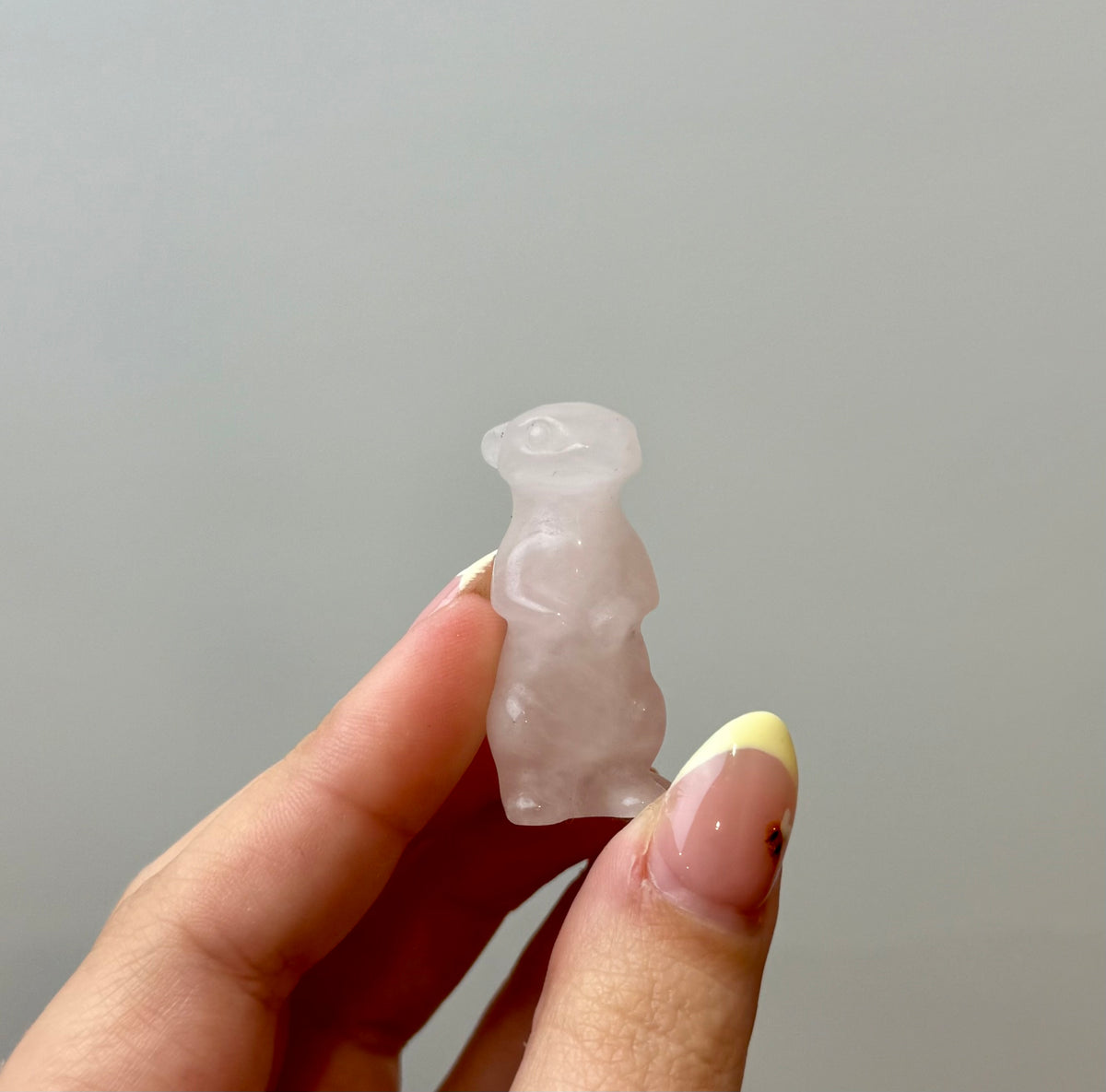 Rose quartz meerkat carving
