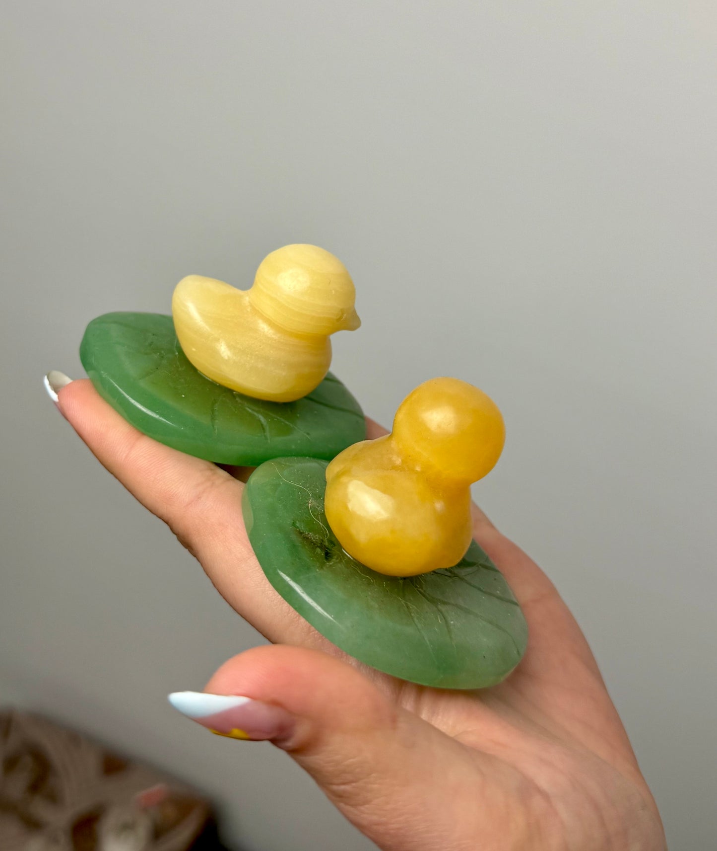 Duck on lily pad carvings