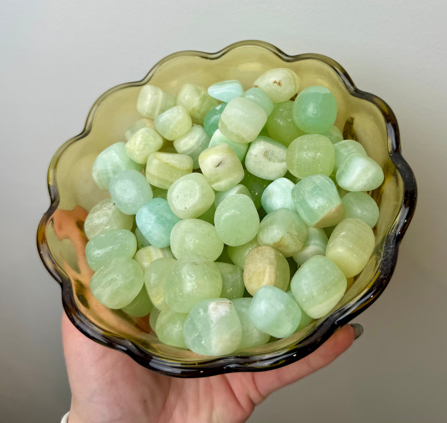 Pistachio green calcite tumbles