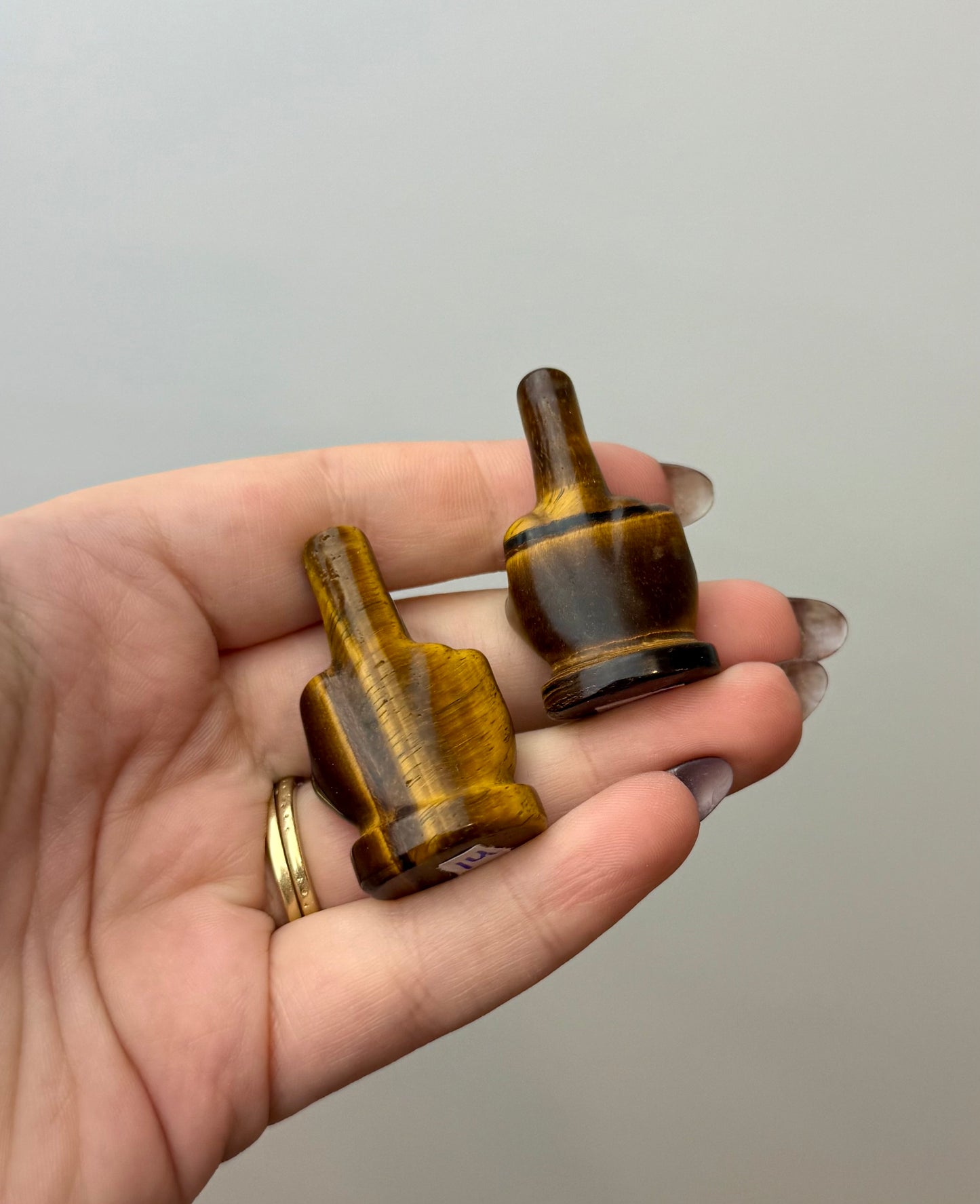 Tigers eye middle finger carvings