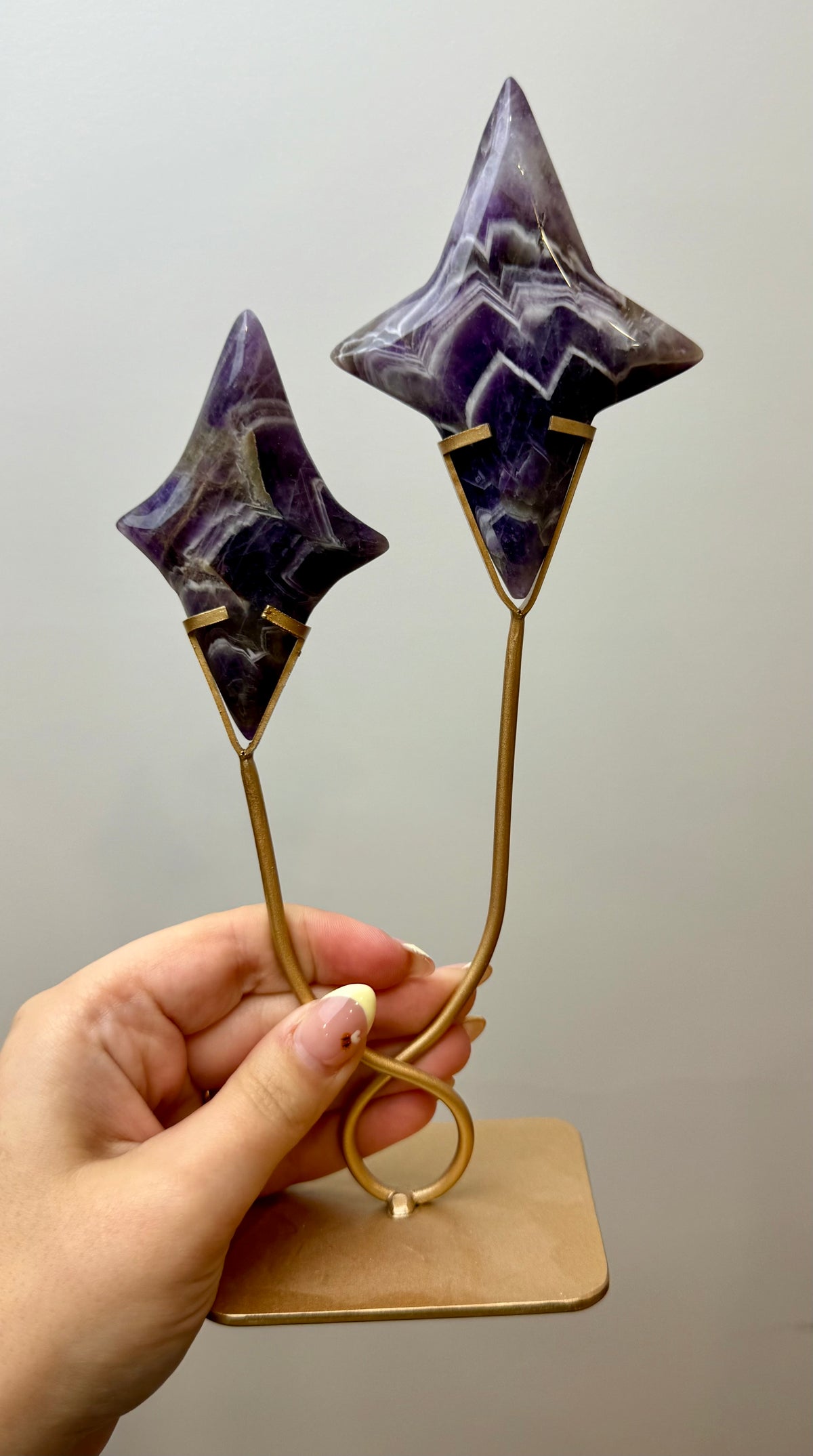 Dream amethyst shooting star carving on a stand
