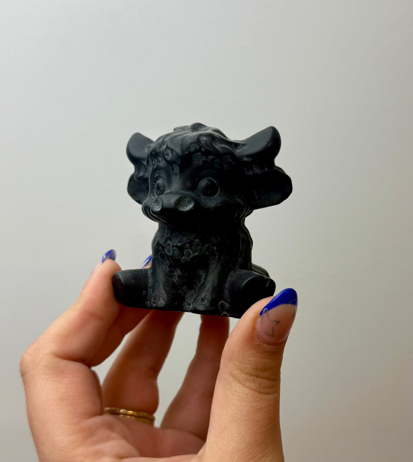 Obsidian cow carving