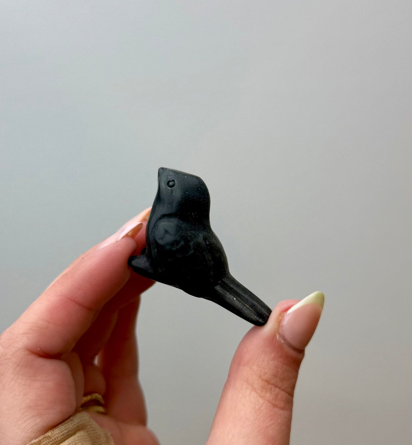 Obsidian bird carving