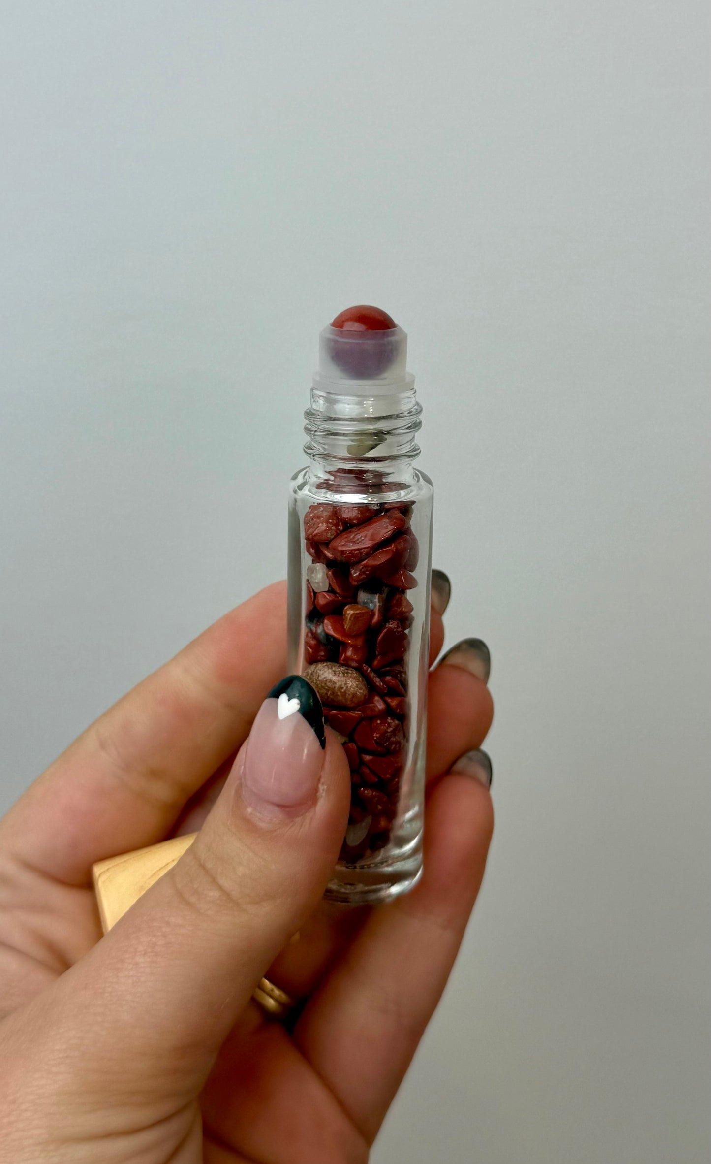Red jasper chip roller bottle