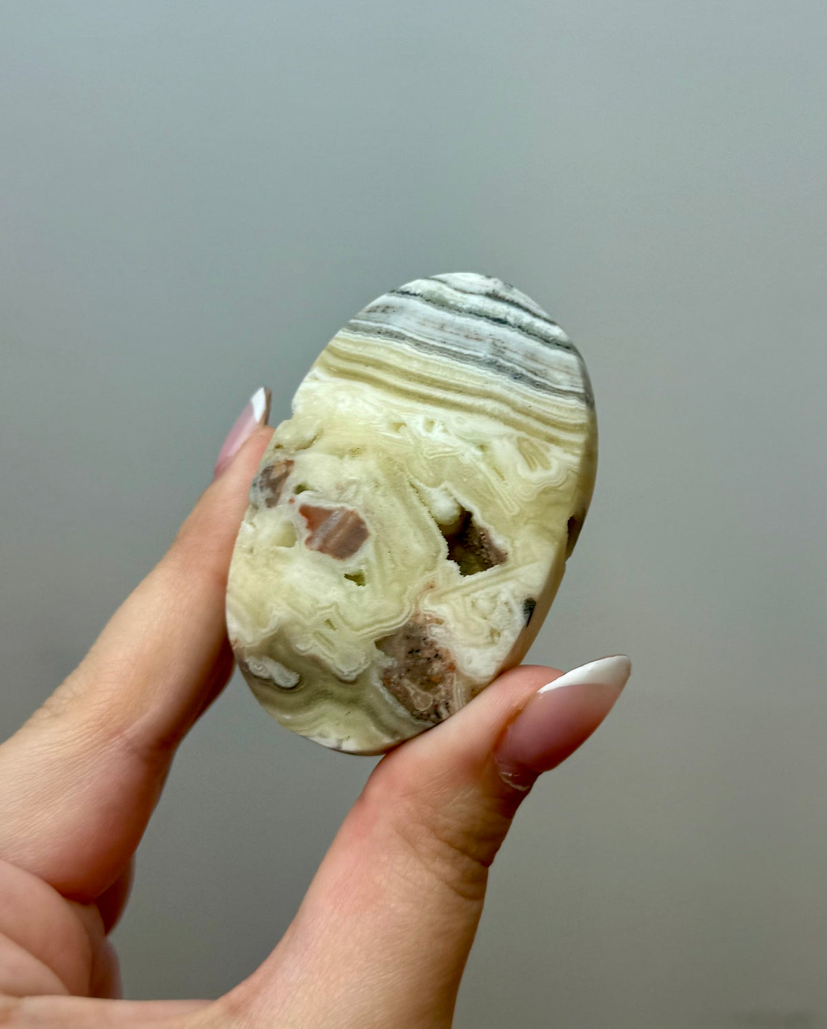 Zebra calcite palm stone