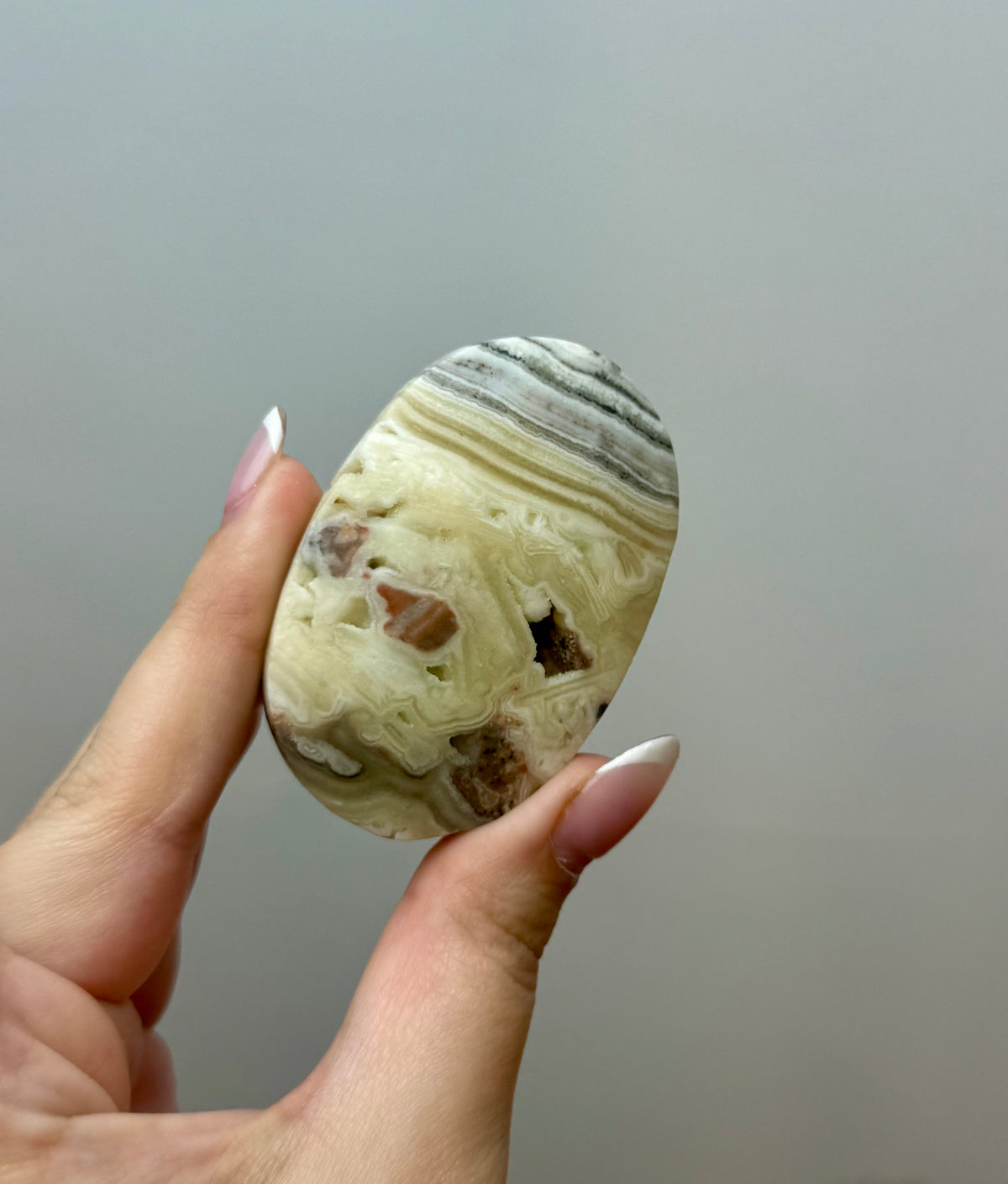 Zebra calcite palm stone