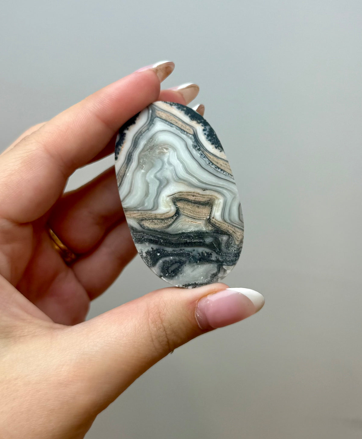 Zebra calcite palm stone