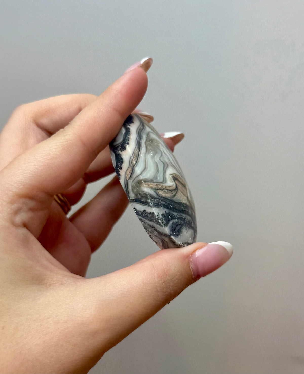 Zebra calcite palm stone