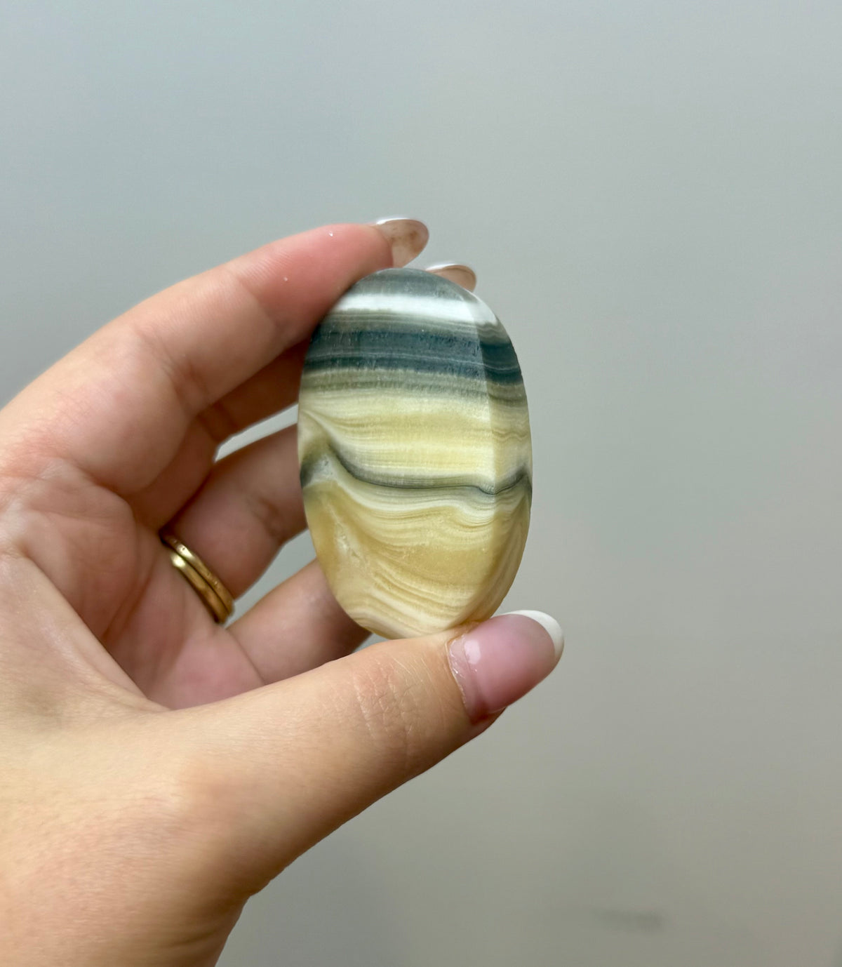 Zebra calcite palm stone