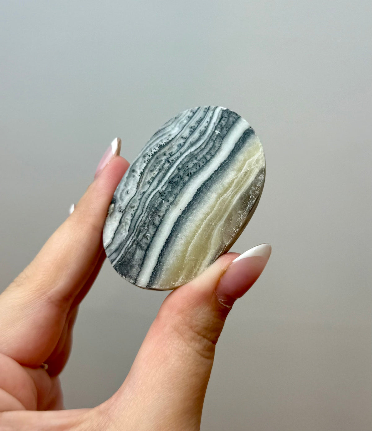 Zebra calcite palm stone