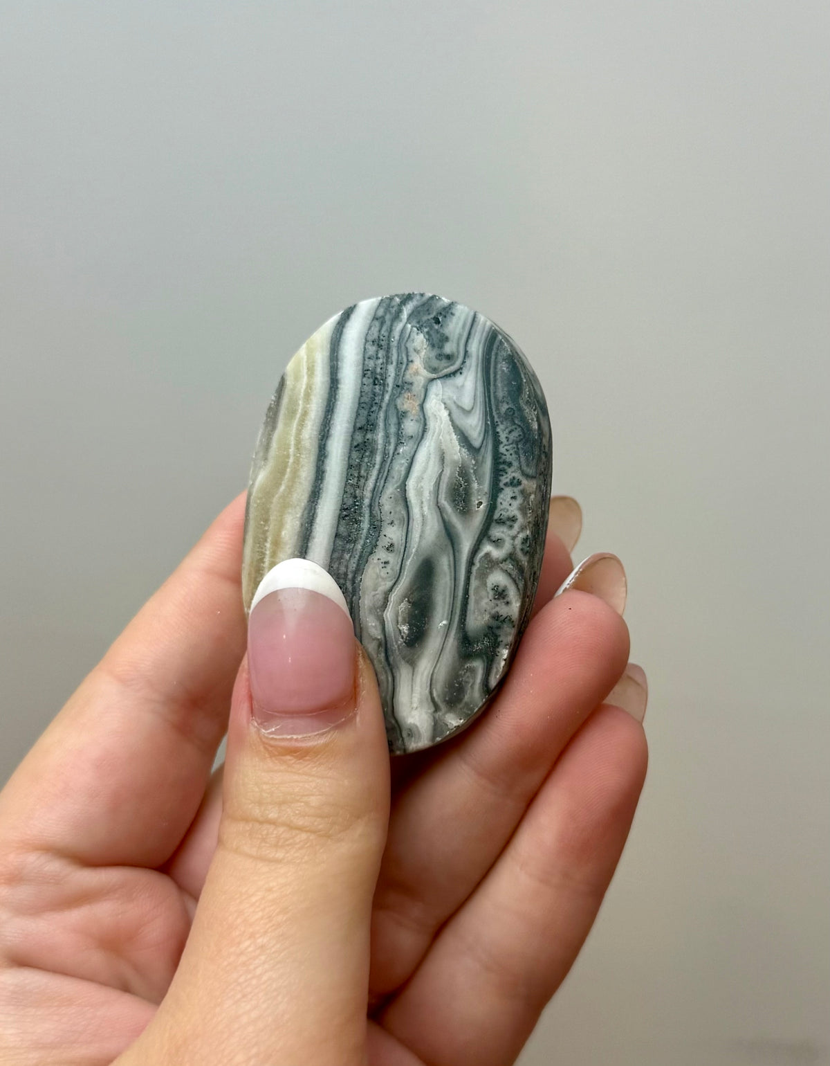 Zebra calcite palm stone