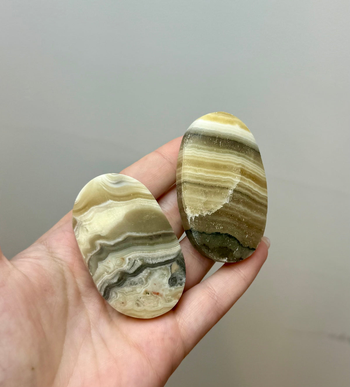 Zebra calcite palm stones