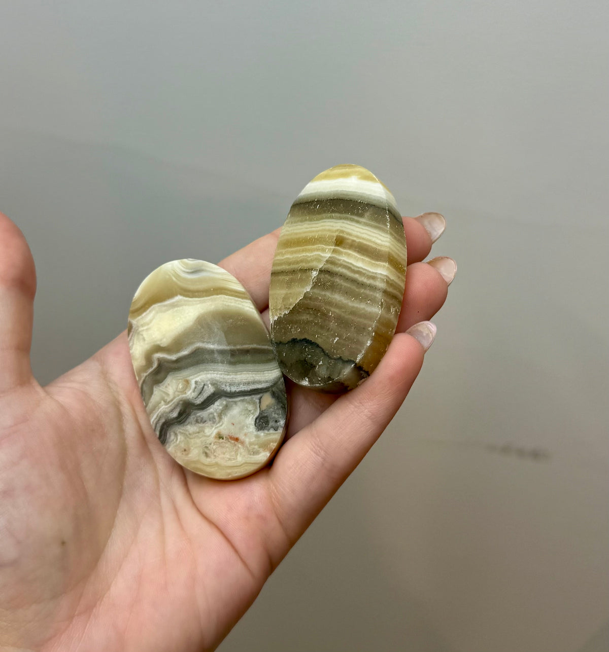 Zebra calcite palm stones